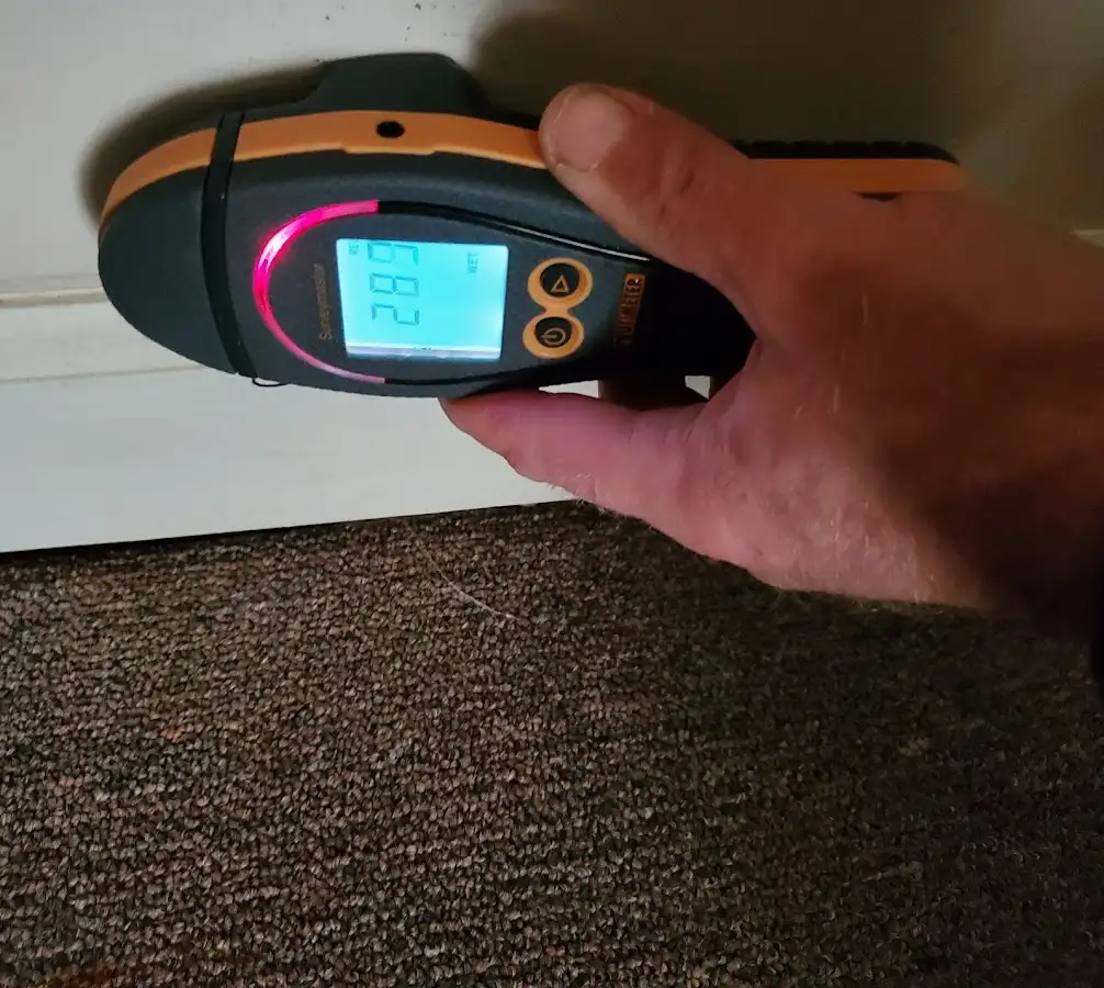 Moisture detection at baseboard during Storm Damage Restoration in Tremonton